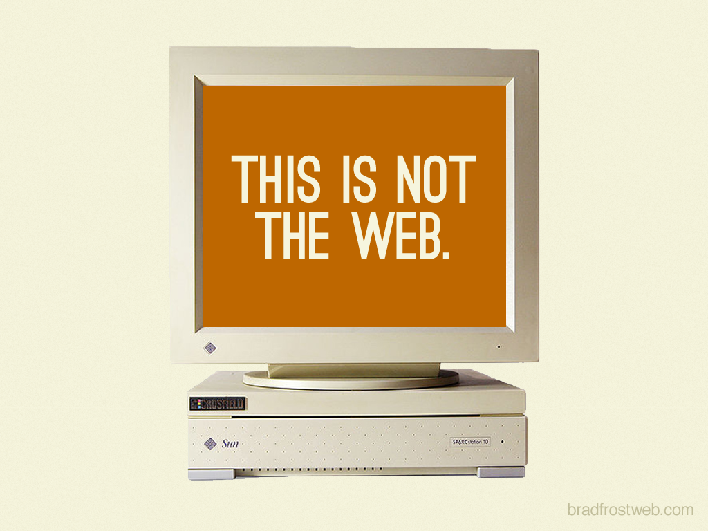 This is not Web と映し出された古いディスプレイのデスクトップ
